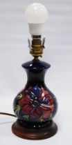 Moorcroft 'Anemone' table lamp with tube lined decoration on a blue ground, fixed to base, 16cm