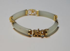 Chinese pale grey jade bangle, in gold, '14k'.