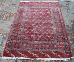 Turkoman Tekke hand-knotted rug with seven rows of four guls and further geometric motifs to the