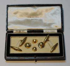 Pair of 18ct gold torpedo cufflinks, two studs, '18ct' (7.7g) and two others, '9ct' (1.5g).