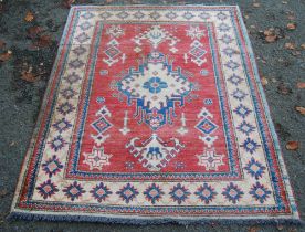 Turkish Milas hand-knotted rug with central geometric medallion flanked by smaller geometric