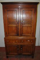 18th century Welsh oak cheese cupboard, the two panelled doors with pierced panels to the centre