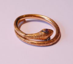 Fine Victorian gold snake bangle, hinged in six sections, engraved with scrolls, the head with