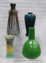 Two Ruskin Pottery vases, one with colourful drip decoration, 15cm high, the other of bottle shape