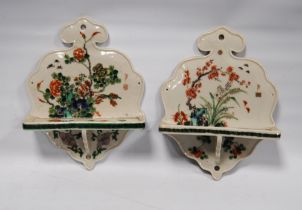 Pair of Chinese famille verte wall pockets of ruyi shape decorated all over with prunus blossom