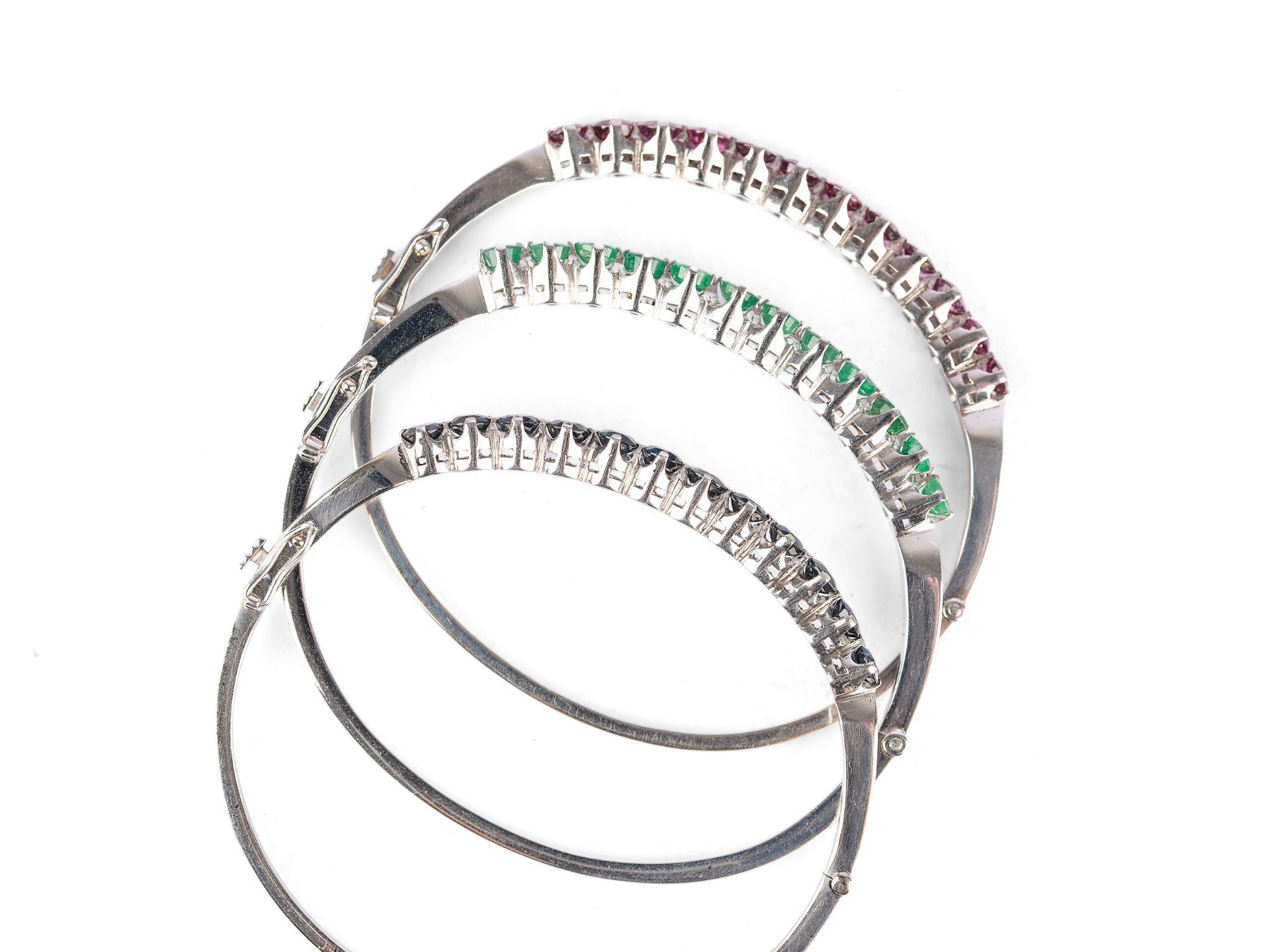 Mixed lot: 3 bangles, 14kt white gold marked, 12 sapphires, emeralds and rubies each? - Image 2 of 2