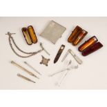 A selection of late 19th/early 20th century accessories, to include a George VI silver cigarette