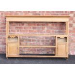 A Victorian pine wall rack, the moulded cornice above a plain frieze and reeded uprights,