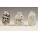 Three Chinese reverse painted snuff bottles, 20th century, comprising an en grisaille example