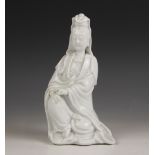 A Chinese porcelain Blanc de Chine figure of Guanyin, early 20th century, modelled seated, draped in