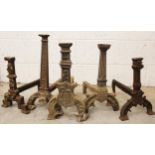 Five single cast iron fire dogs, 17th century and later, to include a fluted example further