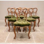 A set of six Victorian satin birch dining chairs, each with a compressed balloon back and scrolled
