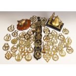 A collection of fifty horse brasses, to include a Manx triskelion example, a Warwick bear example, a