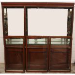 A late 19th/early 20th century and later stained wood museum display cabinet, the moulded cornice