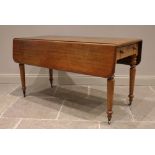 A Victorian mahogany Pembroke table, the rounded rectangular drop leaf top above a pair of