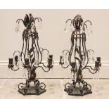 A pair of oxidised copper girandoles, early 20th century, the baluster frame extending to 'S' shaped