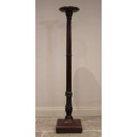 A 19th century mahogany torchere/standard lamp, the circular rimmed top raised upon a cluster column