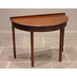 A mahogany demi lune hall table, in the Adam style, early 20th century, the bow front top with