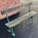 A late 19th century painted iron and hardwood garden bench, the cast 'X' frame supports extending to