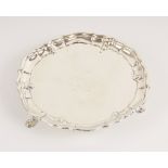 A George II silver waiter, John Tuite, London 1735, of circular form with pie crust border on