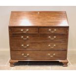 A George III mahogany bureau, the fall front above two short and three long drawers and opening to