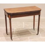 A George III mahogany tea table, the rectangular folding top with rounded corners and a reeded edge,
