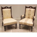 A pair of Victorian lady's and gentleman's walnut and upholstered armchairs, the serpentine top rail
