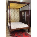 A 19th century mahogany tester bed, the moulded frame and foliate fabric canopy applied with leafy