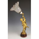 A French gilt effect spelter table lamp, early 20th century, modelled as Cupid or Eros with his