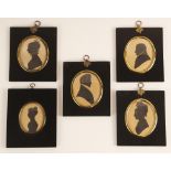 Four oval portrait silhouettes on paper, 19th century, depicting a lady wearing a ribboned bonnet, a