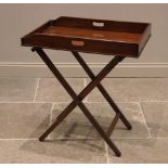 A mahogany butlers tray and associated stand, 19th century, the galleried tray with hand apertures