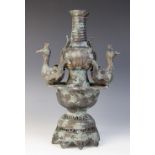 A Chinese archaic bronze vessel, 20th century, of baluster form and with pierced, domed base applied