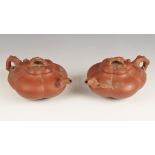 A pair of Yixing teapots and covers, early 20th century, each of compressed hexagonal form and