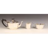 A George V silver tea service, Barker Brothers Silver Ltd, Birmingham 1935, comprising teapot,