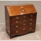 A George III mahogany bureau, the hinged fall front centred with an inlaid boxwood urn confined by