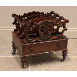 A rosewood canterbury, 19th century, the four carved scrolling openwork divisions, united by