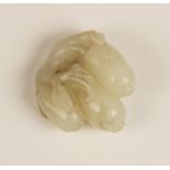 A Chinese pale jade carving, modelled as three gourds descending from a branch, 3.7cm