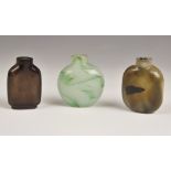 Three Chinese glass snuff bottles, 19th/20th century, comprising; a marbled green circular