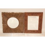 A carved oak wall mirror, 20th century, the rectangular frame carved with grapes and vinery