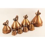 A set of seven graduated copper measures, 19th century, comprising: 1/2 gill, 1 gill, 1/2 pint,