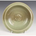 A Chinese Longquan celadon 'Twin Fish' bowl, Song Dynasty, the circular bowl with shallow rounded