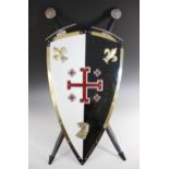 A reproduction "Knights Of Jerusalem" medieval shield, 78cm high, with two medieval style decoration