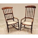 A 19th century beech and fruit wood rocking chair, the spindled back above a rattan seat, raised