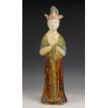A Chinese pottery sancai glazed funerary tomb figure, possibly Tang Dynasty, sculpted as a civil