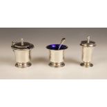 A silver three-piece cruet set, Joseph Gloster Ltd, Birmingham 1956, comprising pepperette, wet