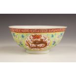 A Chinese porcelain famille jaune dragon bowl, Guangxu (1875-1908), the circular bowl decorated to