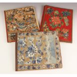 Three Chinese silk covered folios, early 20th century, each cover set with a silk embroidered