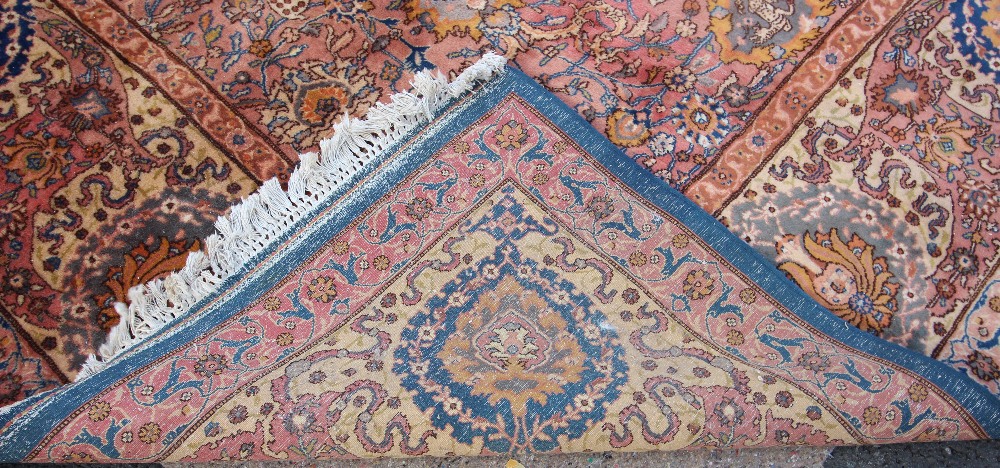 A large Persian pattern wool rug, in blue, pink and yellow colourways, the central field applied - Image 2 of 2