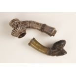 A large Burmese white metal pipe, 19th century, the base inset with a 1 kyat coin, provenance: The
