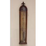 A Victorian Gothic influence walnut cased Admiral Fitzroy barometer, late 19th century, the case